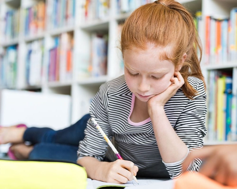 A child concentrating during a learning activity